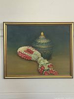 Framed oil painting depicting jasmine garland and Benjarong bowl