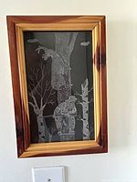 Full view of framed drypoint drawing on wall