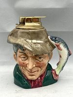 Front view showing poacher face, fish handle and Ronson mount