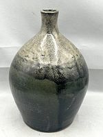 Front view of glazed bottle vase