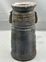Full frontal view of cylindrical Bizen ware vase showing ash glaze and lug handles