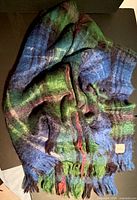 Photo of the blue and green plaid mohair blanket showing texture and overall design.