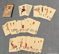 Full view of all cards laid out including the joker card and original box.