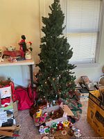 Full view of tree with ornaments and lights