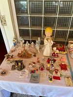 Group shot of all nativity figurines, ornaments, pillow and light-up angel