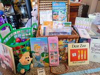 All items grouped showing Elsa doll, books, baskets, eggs, plush and phone