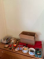 Overall view of tools, tapes, box on dresser