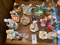 Wide shot showing all figurines grouped with lot tag 353