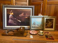 overview with framed art, plates, wooden plane, tile wall hanging