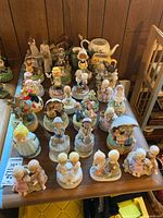 Top view of full assortment of porcelain musical figurines on table
