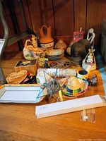 Full lot showing variety of international collectibles on floor