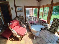 Overall view of wicker seating set in sunroom