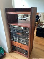 Full view of padauk wood rack with mounted audio components
