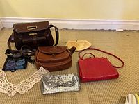 Group shot of six handbags on carpet
