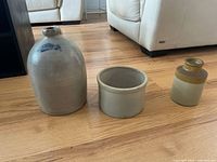 Overall view of jug, crock, and vase