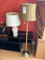 Both lamps standing together for scale and style comparison