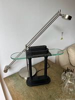 Both lamps side by side on tabletop; shows overall form and materials