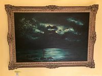 Frontal view of framed oil painting