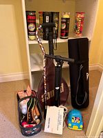 Overall lot showing racket, pump, mat, ping pong set, tennis balls, jump rope, Mickey car