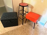 All three pieces grouped: fabric storage ottoman, metal stool, vinyl sewing stool