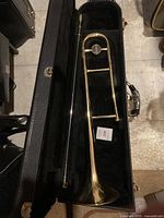 Trombone and slide assembly inside lined hard case