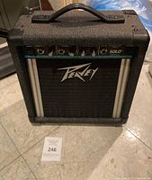 Front angle view of Peavey Solo guitar amplifier with handle and logo visible.