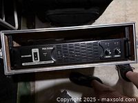 Front full view of Accusonic PSA-31500 professional stereo amplifier in a rack case, showing overall condition and size.