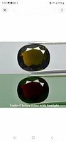 Two side-by-side views of chrome tourmaline showing greenish color on top and deep red under Chelsea filter with sunlight on bottom.