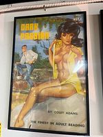 Framed pulp poster titled 'Dark Passion' by Coley Adams, showing a woman and a man in a vintage pulp fiction style.