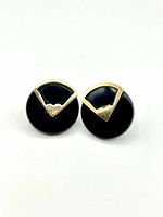 Front view of both earrings showing onyx discs and gold chevron detail