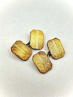 Front view showing four gold panels with engraved patterns