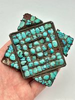 Front view showing turquoise cabochon mosaic and overall design