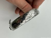 Close-up of floral engraving on bracelet exterior