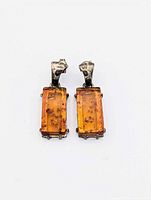Front view of pair of sterling silver amber dangle earrings