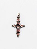 front view showing garnet stones and cross design