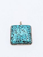Front view of square turquoise pendant showing cabochon and silver bezel
