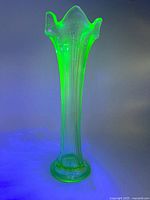 Vase glowing bright green under UV light
