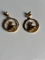 Front view of both earrings showing design and shape