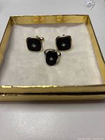 Ring and cufflinks front view in display box