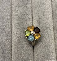 Top view of ring showing five heart-shaped stones forming flower