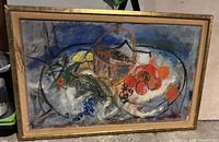 Overall view of framed painting showing abstract still life with fruit, frame visible