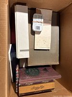 Cardboard box with stockbooks, envelopes and pages (cigar box excluded)