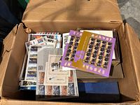 Box containing loose full stamp panes including various commemorative issues