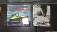 Two Titanic-themed books side by side showing front covers: a colorful illustrated history and a grayscale building the Titanic book