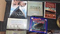Photo showing six Titanic-themed books arranged on a surface.