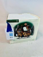 Photo showing the original numbered box with the product image and some packaging wear.