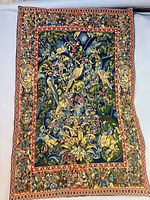 Full view of the tapestry laid flat on light background