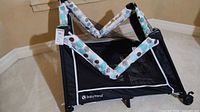 Overall view of folded Baby Trend playpen
