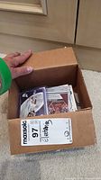 Box with sleeved NBA trading cards