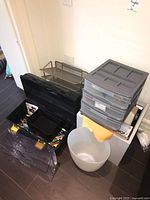Group shot showing toolbox, plastic drawer organizer and wastebasket